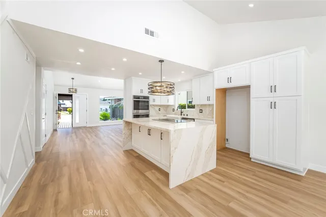 a kitchen with a stove and a sink