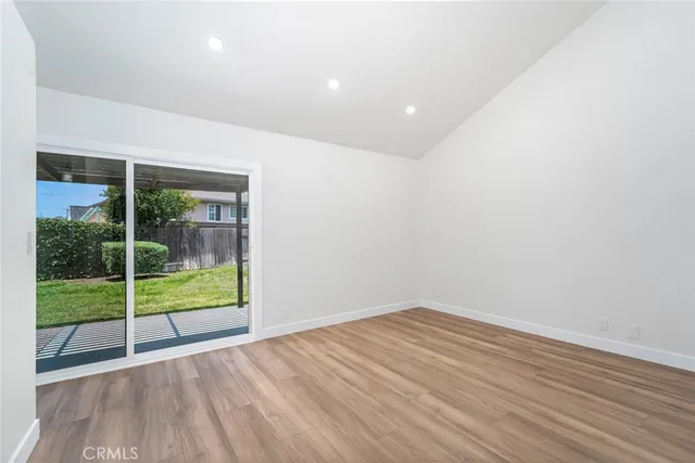 a view of room with wooden floor