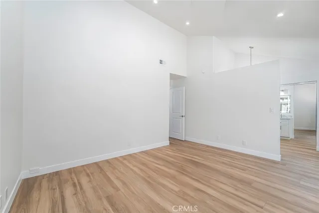 a spacious bathroom with a double vanity sink a mirror and a shower