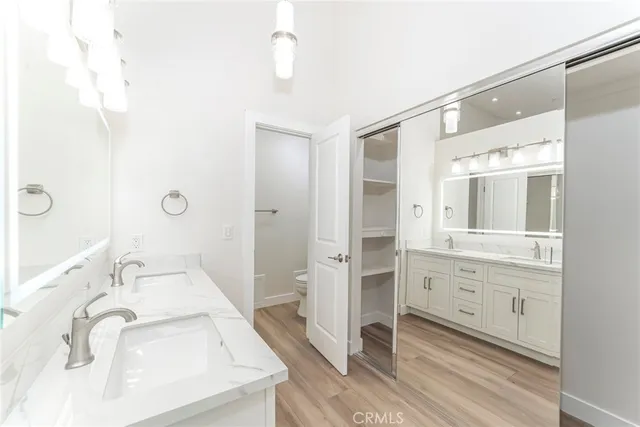 a bathroom with a sink double vanity and a mirror