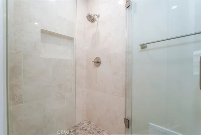 a view of a backyard with a garden and entertaining space