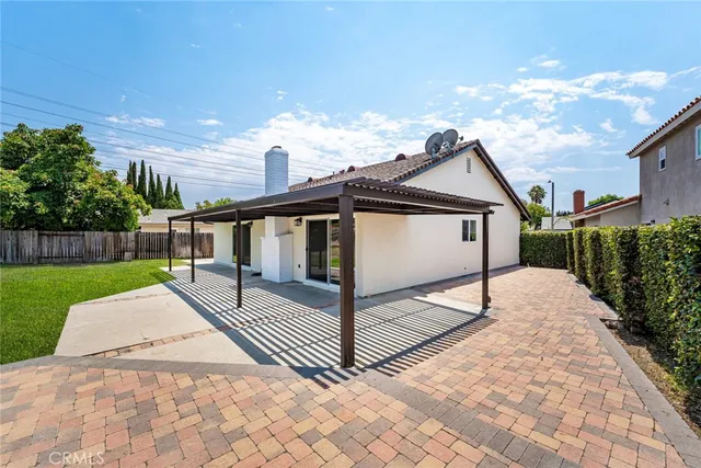 a view of a backyard and floor to ceiling window