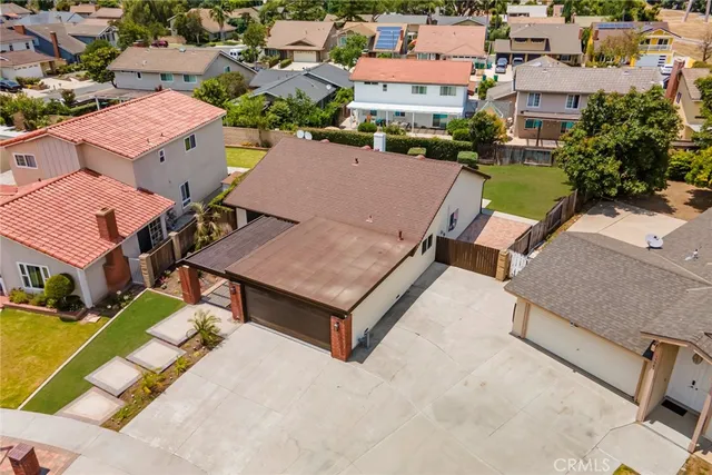 an aerial view of houses with swimming pool