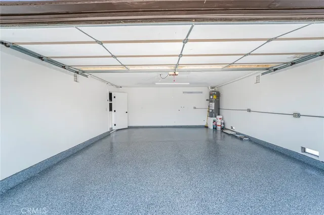 an aerial view of a house with a yard and pool
