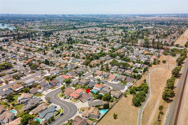 an aerial view of residential houses with outdoor space