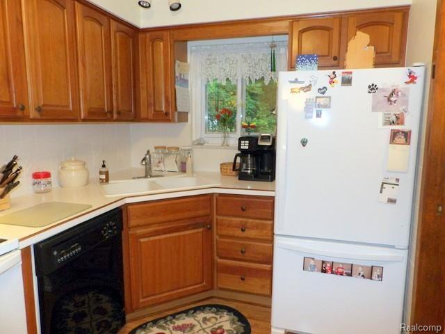 8750 Rucker Road Grosse Ile, MI 48138 - Photo 25 of 54 MAPLE RAISED-PANEL CABINETS AND CERAMIC TILE BACKSPLASH!