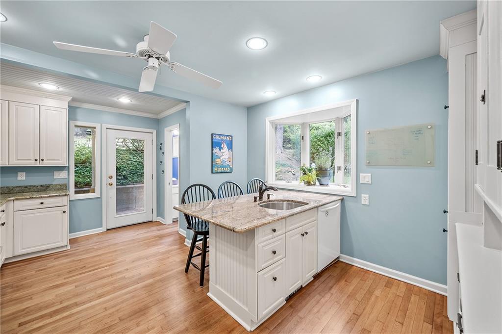 325 Sycamore Road Sewickley, PA 15143 - Photo 16 of 49 a kitchen with a wooden floor window and chairs