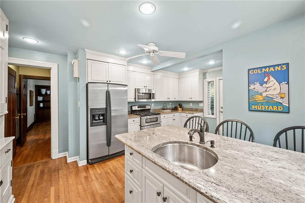 325 Sycamore Road Sewickley, PA 15143 - Photo 17 of 49 a kitchen with refrigerator sink and cabinets