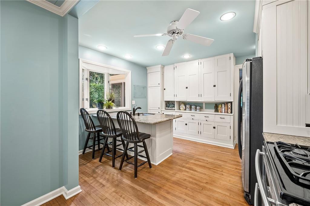 325 Sycamore Road Sewickley, PA 15143 - Photo 20 of 49 a kitchen with stainless steel appliances a table chairs refrigerator and cabinets