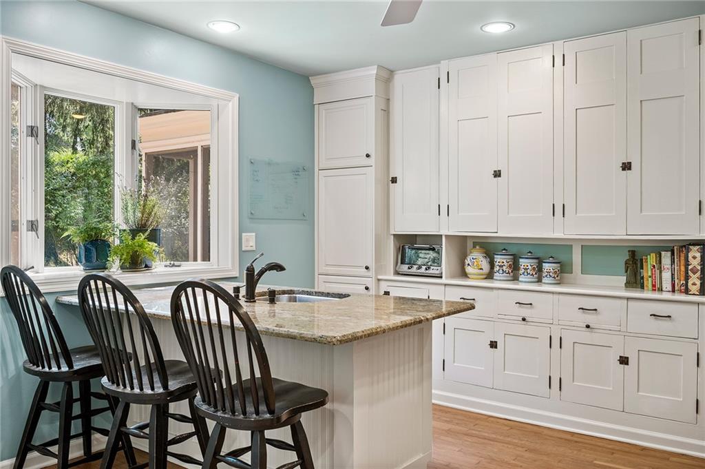 325 Sycamore Road Sewickley, PA 15143 - Photo 21 of 49 a kitchen with a white cabinets and chandelier
