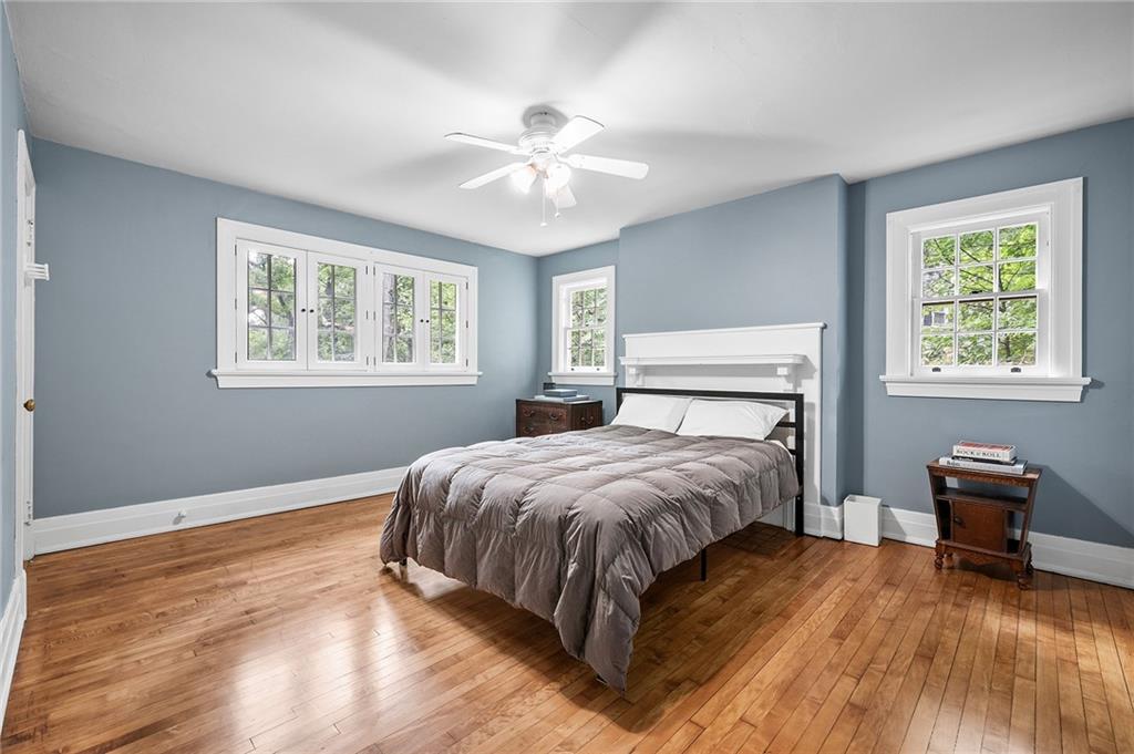 325 Sycamore Road Sewickley, PA 15143 - Photo 24 of 49 a bedroom with a bed and wooden floor