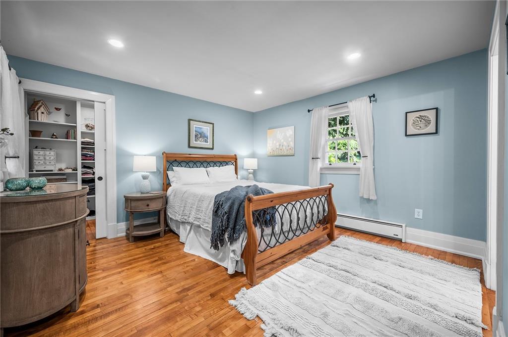 325 Sycamore Road Sewickley, PA 15143 - Photo 29 of 49 a bedroom with a bed and wooden floor