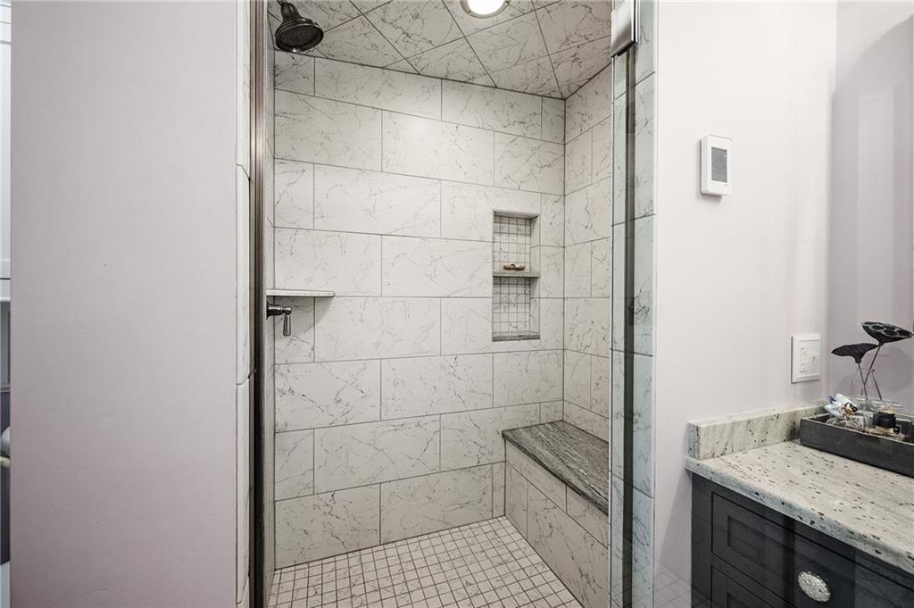 325 Sycamore Road Sewickley, PA 15143 - Photo 32 of 49 a bathroom with a granite countertop sink a toilet and shower
