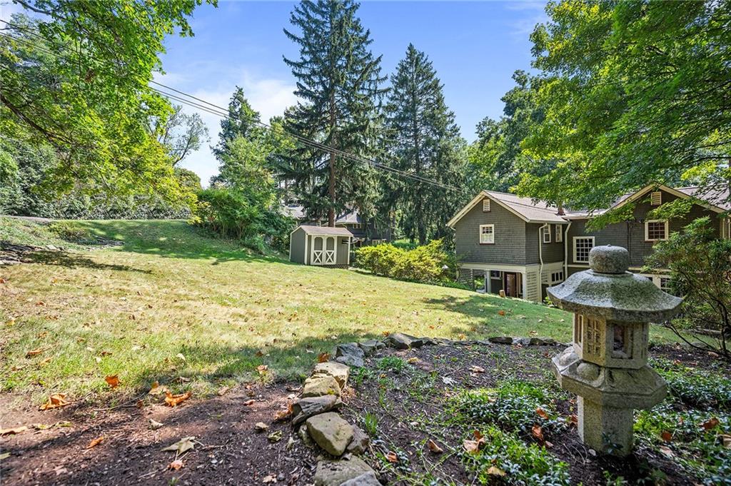 325 Sycamore Road Sewickley, PA 15143 - Photo 41 of 49 a front view of a house with garden