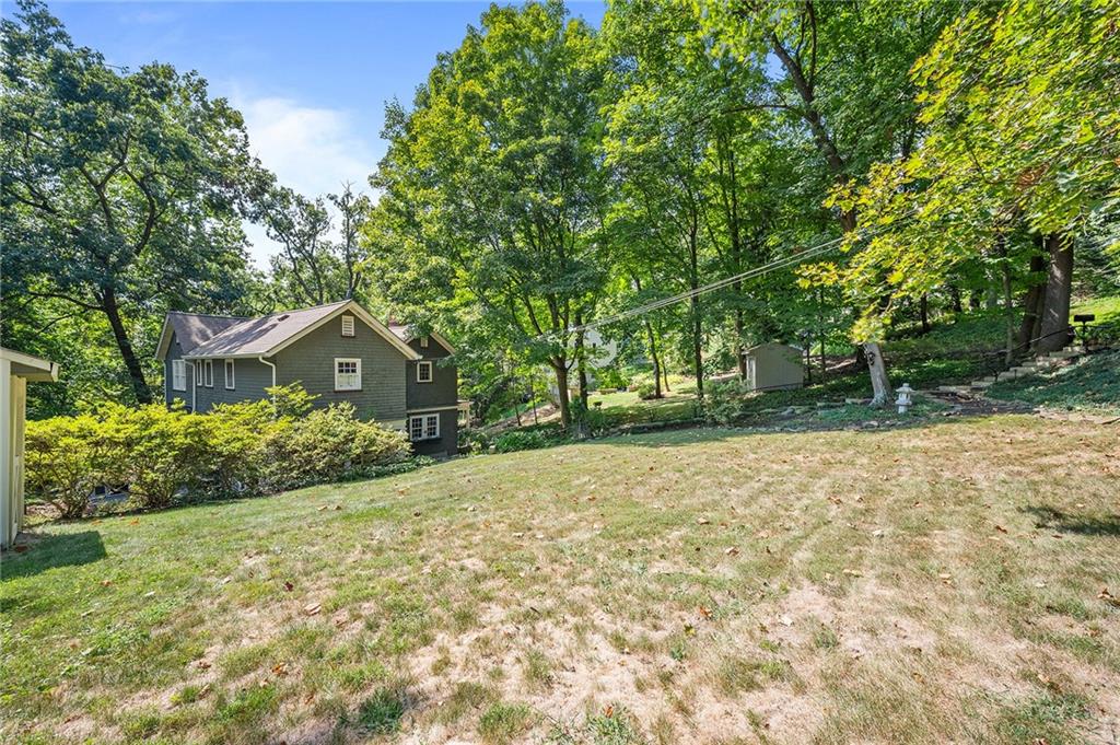 325 Sycamore Road Sewickley, PA 15143 - Photo 43 of 49 a front view of a house with a yard