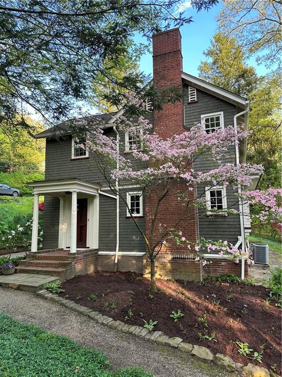 325 Sycamore Road Sewickley, PA 15143 - Photo 49 of 49 a front view of a house with a yard