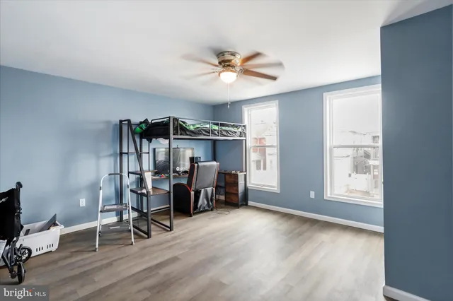 a view of a livingroom with furniture and a window
