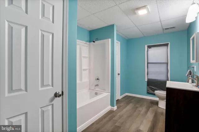 a bathroom with a bathtub and a sink