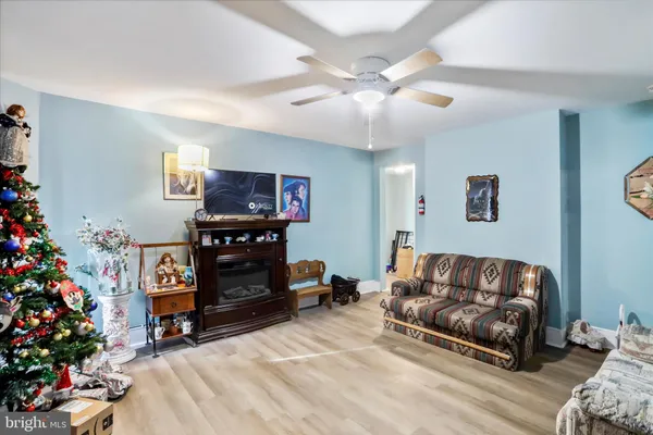 a living room with furniture and flowers