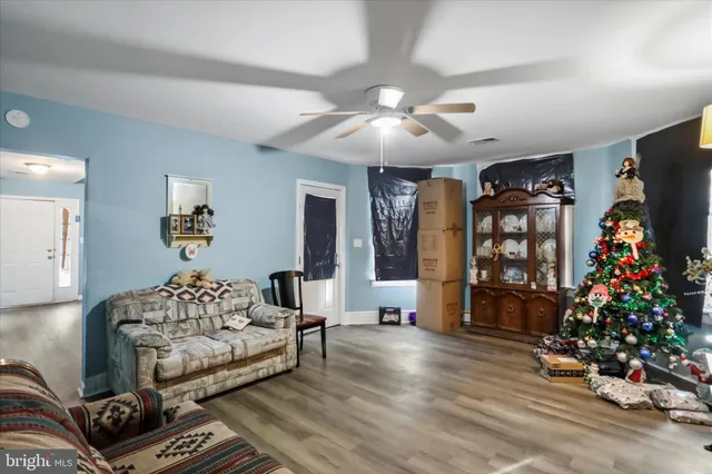 a bedroom with furniture and a large window