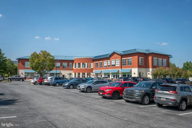 a view of cars parked in front of a building