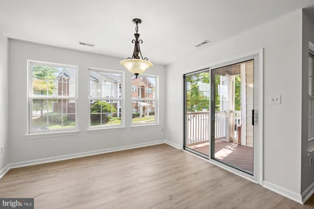 a view of an empty room with windows