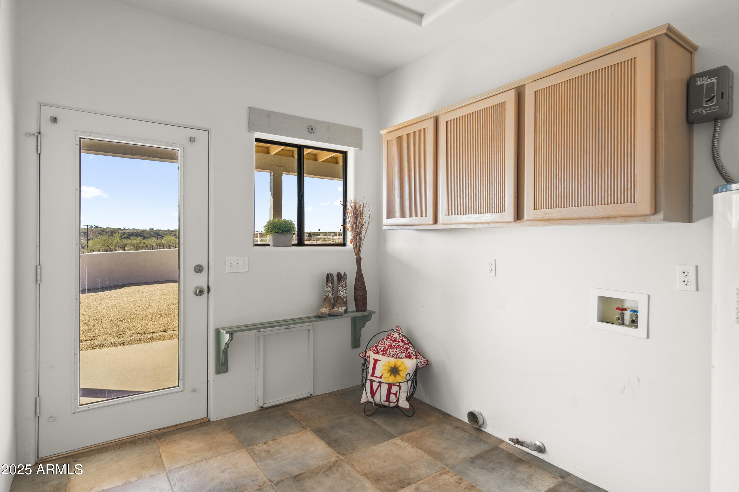 18330 Moonlight Mesa Road Wickenburg, AZ 85390 - Photo 11 of 31 a view of a livingroom with wooden floor and a window