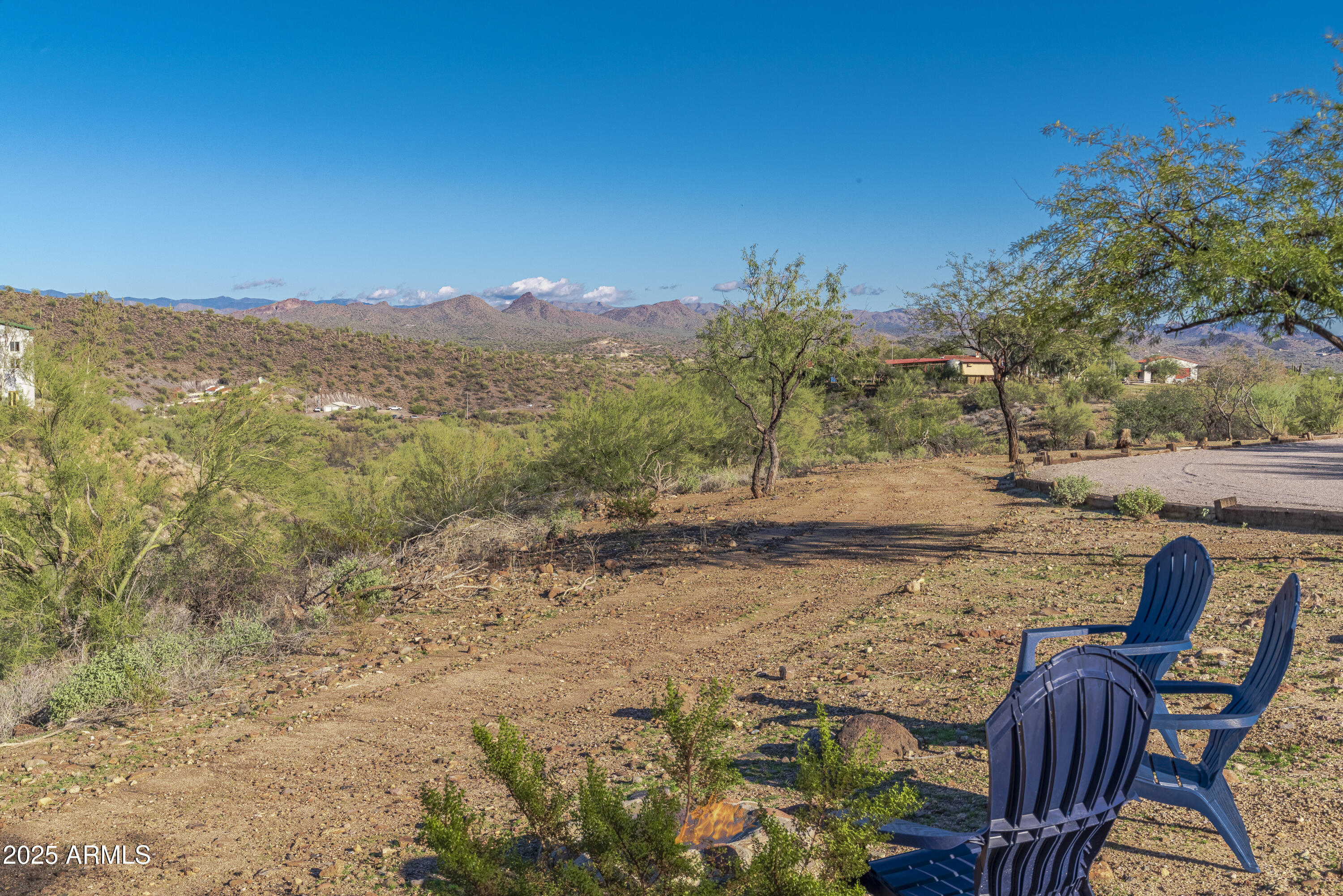 18330 Moonlight Mesa Road Wickenburg, AZ 85390 - Photo 20 of 31 a view of a lake with a mountain