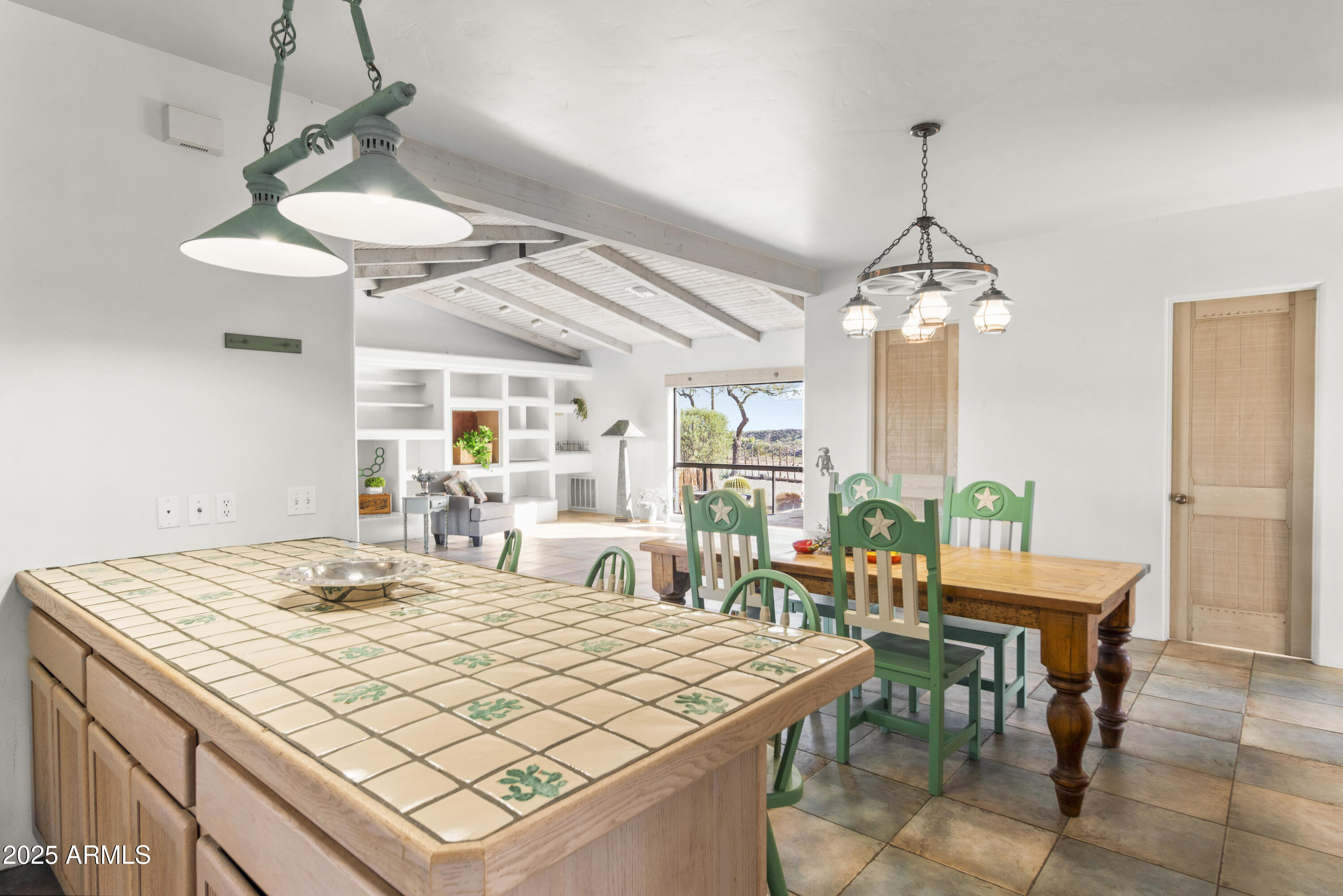 18330 Moonlight Mesa Road Wickenburg, AZ 85390 - Photo 21 of 31 a room with chandelier furniture and a chandelier