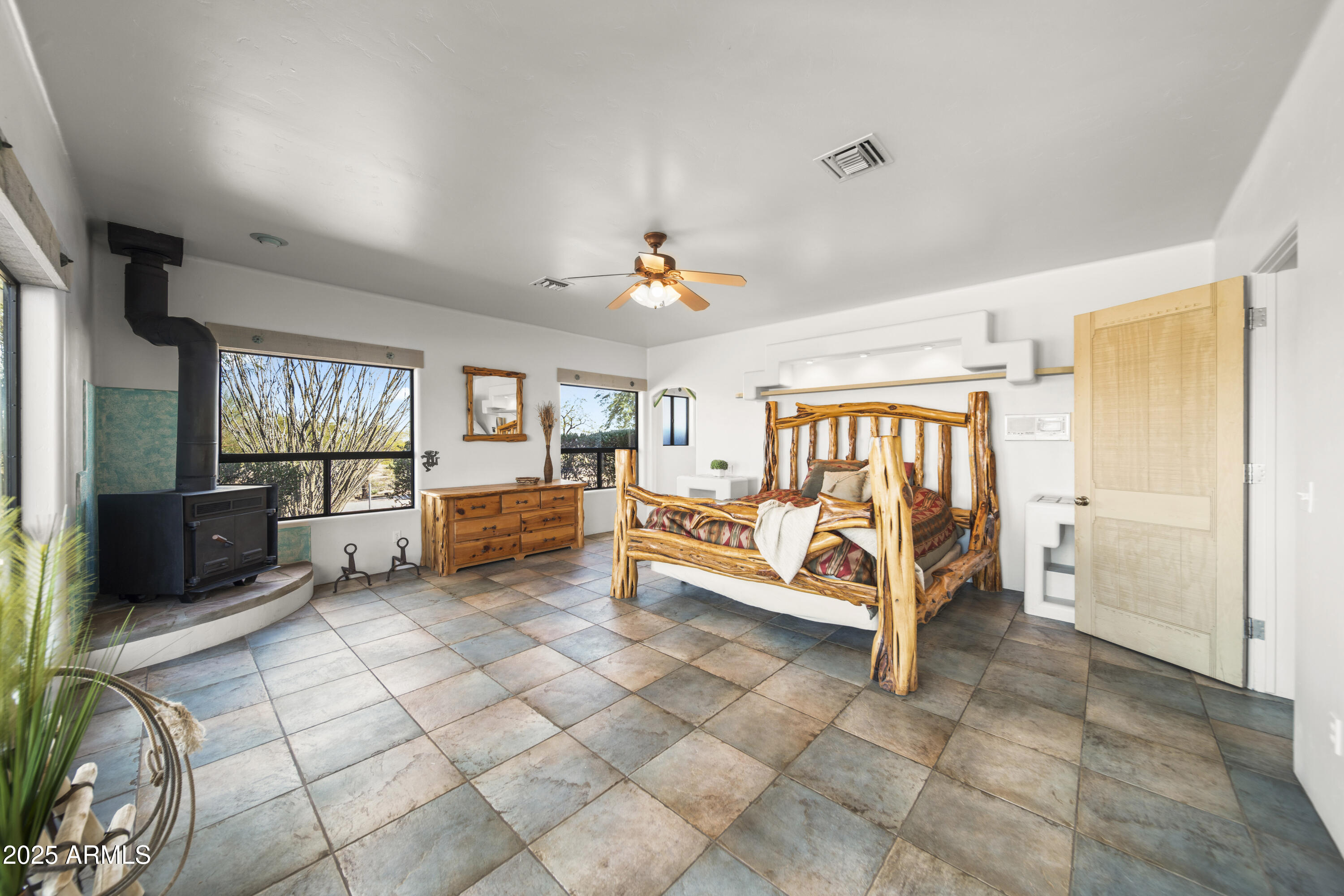 18330 Moonlight Mesa Road Wickenburg, AZ 85390 - Photo 24 of 31 a living room with furniture and a flat screen tv