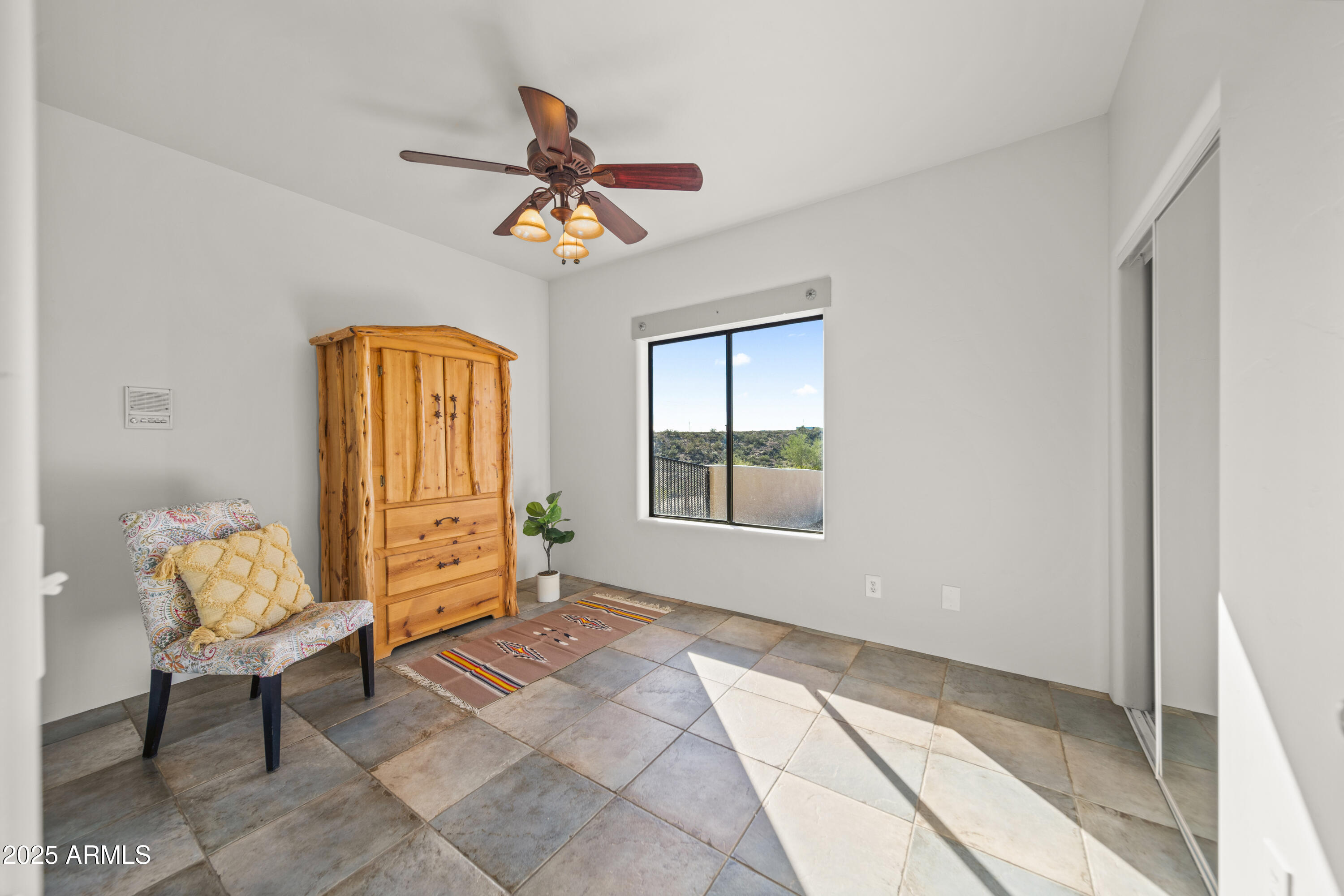 18330 Moonlight Mesa Road Wickenburg, AZ 85390 - Photo 25 of 31 a view of an entryway with wooden floor and a chandelier fan