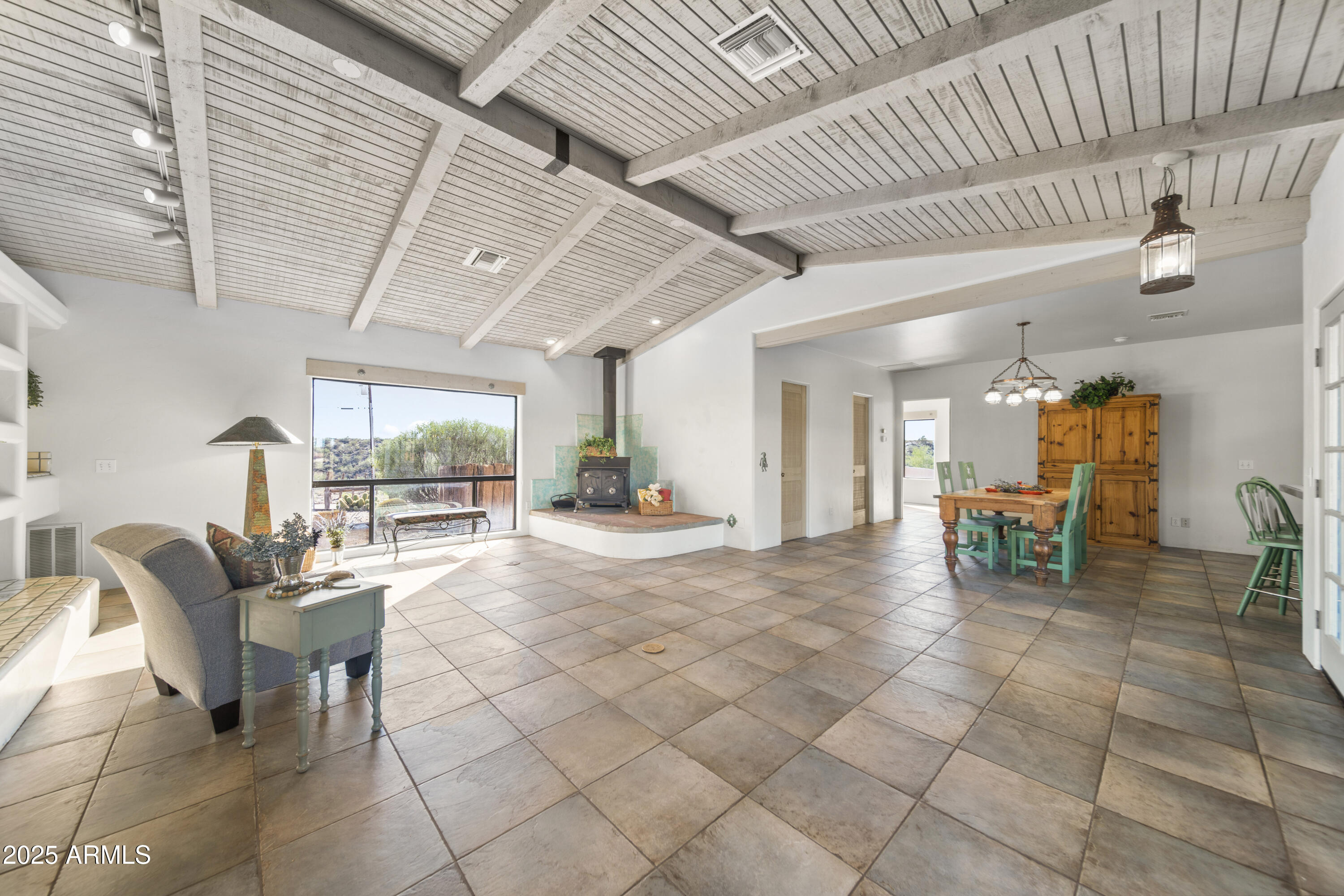 18330 Moonlight Mesa Road Wickenburg, AZ 85390 - Photo 3 of 31 a view of a livingroom with furniture and a flat screen tv