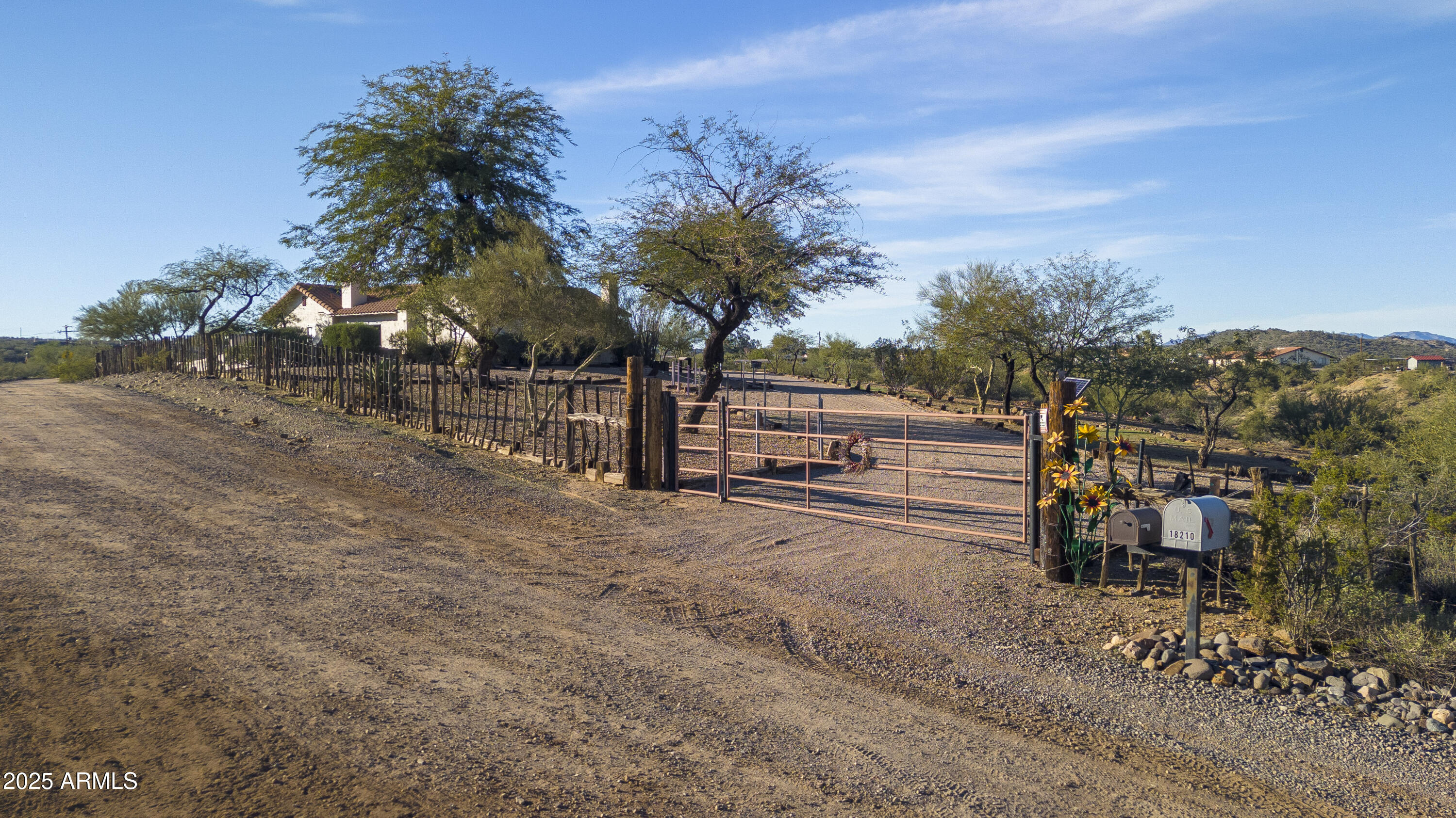 18330 Moonlight Mesa Road Wickenburg, AZ 85390 - Photo 6 of 31 a view of street with wooden stairs and yard