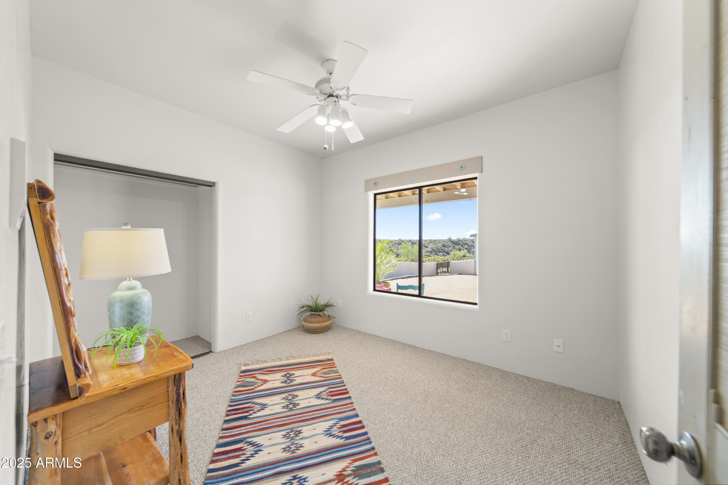 18330 Moonlight Mesa Road Wickenburg, AZ 85390 - Photo 10 of 31 a view of an empty room with a window