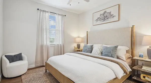 a bedroom with bed and a couch