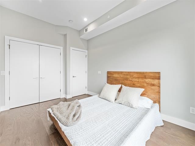 618 Madison Street, Unit 4 Hoboken, NJ 07030 - Photo 14 of 27 a bedroom with a bed and a night stand