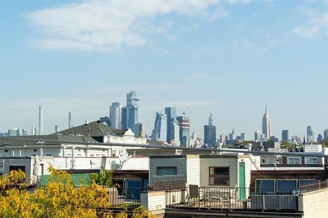 618 Madison Street, Unit 4 Hoboken, NJ 07030 - Photo 24 of 27 a view of a lake and a city