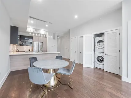 a kitchen with a sink stainless steel appliances and cabinets