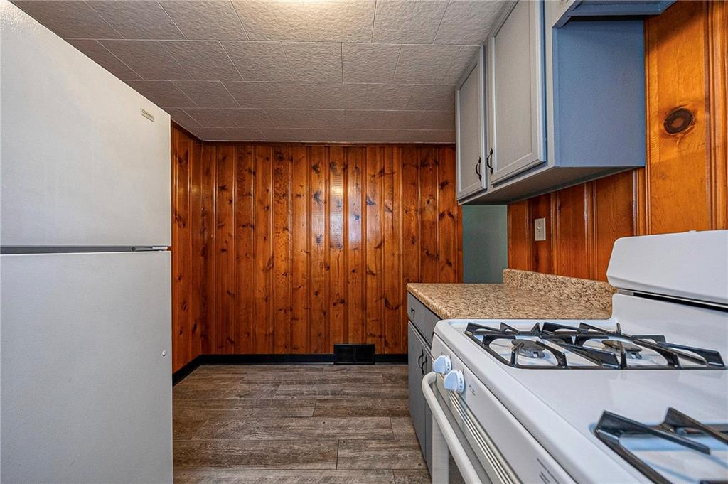 531 Laughlin Avenue Pittsburgh, PA 15210 - Photo 9 of 35 a kitchen with a stove and a refrigerator