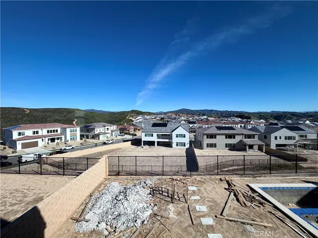 a view of a swimming pool with a lounge chair