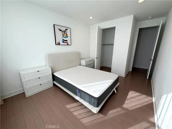 a bed room with a bed and a desk