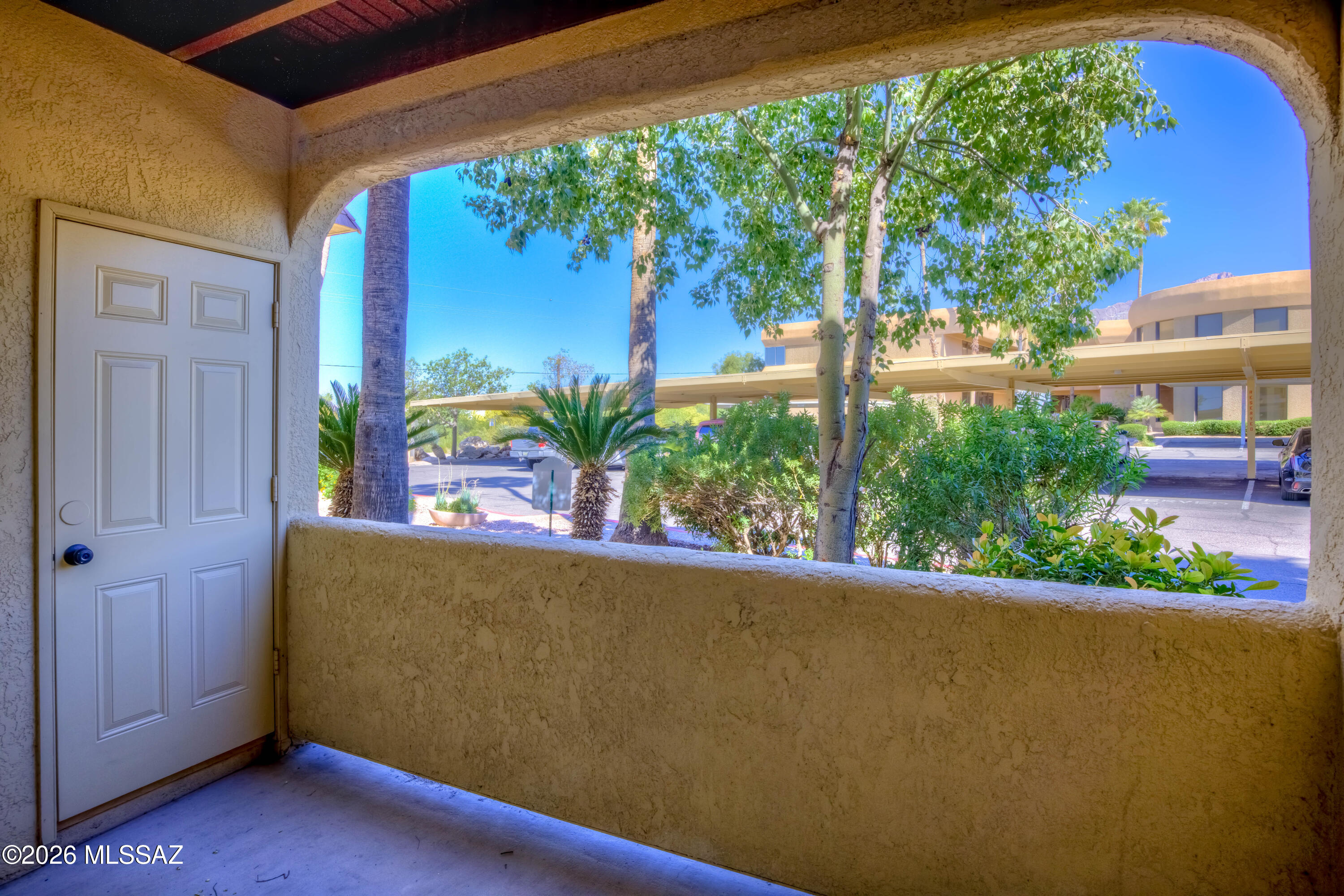 5500 North Valley View Road, Unit 123 Tucson, AZ 85718 - Photo 32 of 36 front view of a house with a potted plant