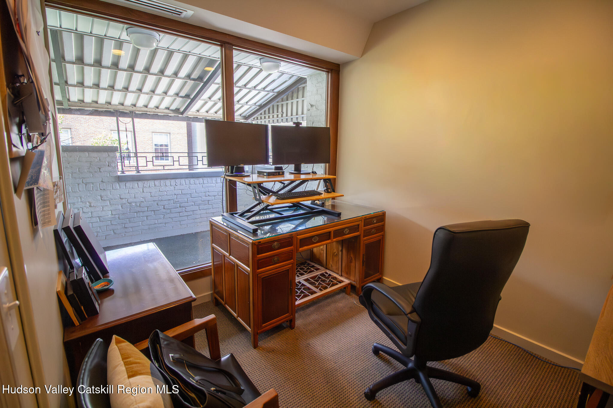28 2nd Street Troy, NY 12180 - Photo 13 of 27 a view of a workspace with furniture and a window