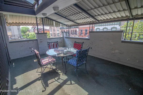 a view of a dining room with furniture window and outside view