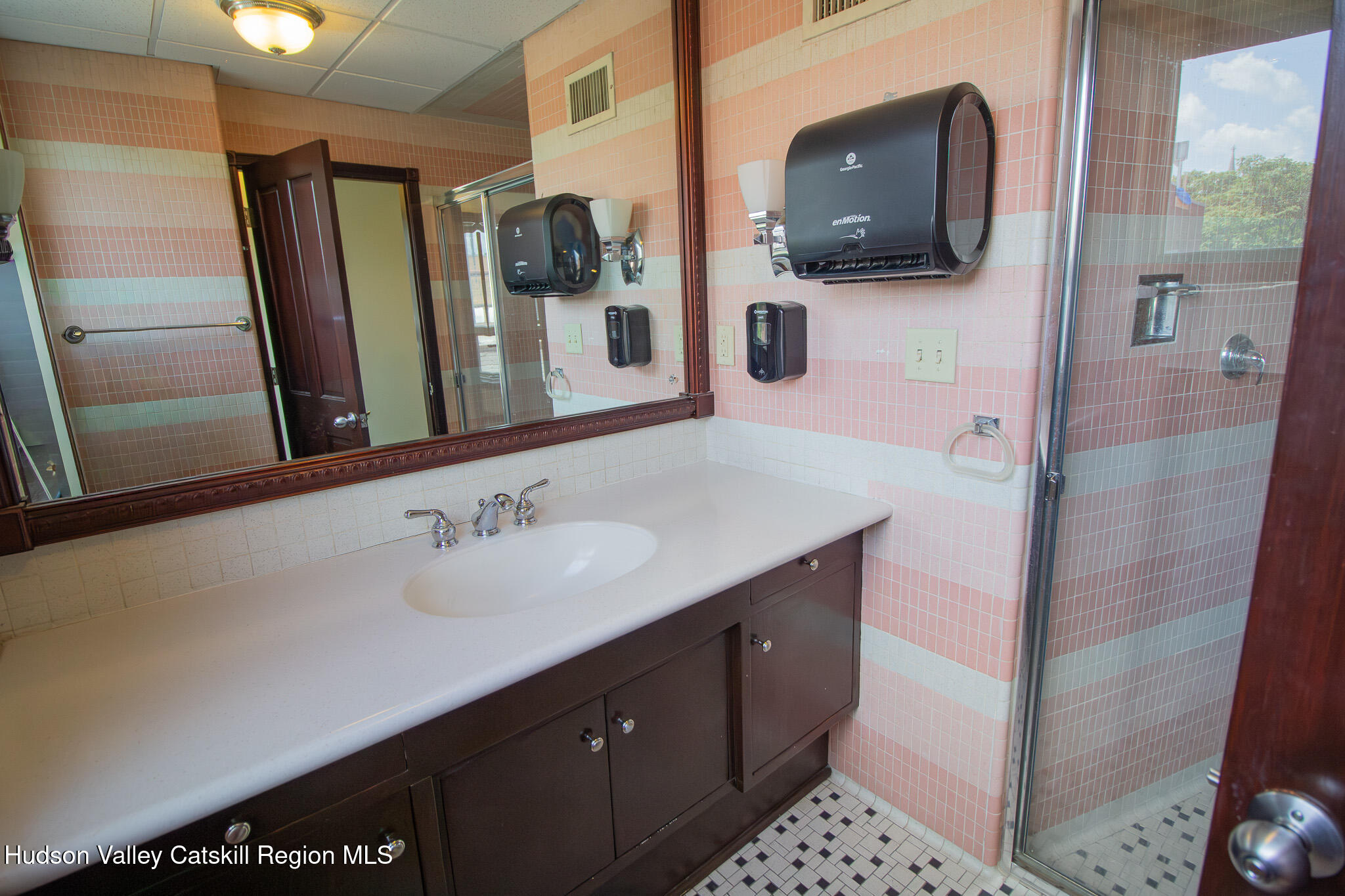 28 2nd Street Troy, NY 12180 - Photo 18 of 27 a bathroom with a sink a large mirror and bathtub