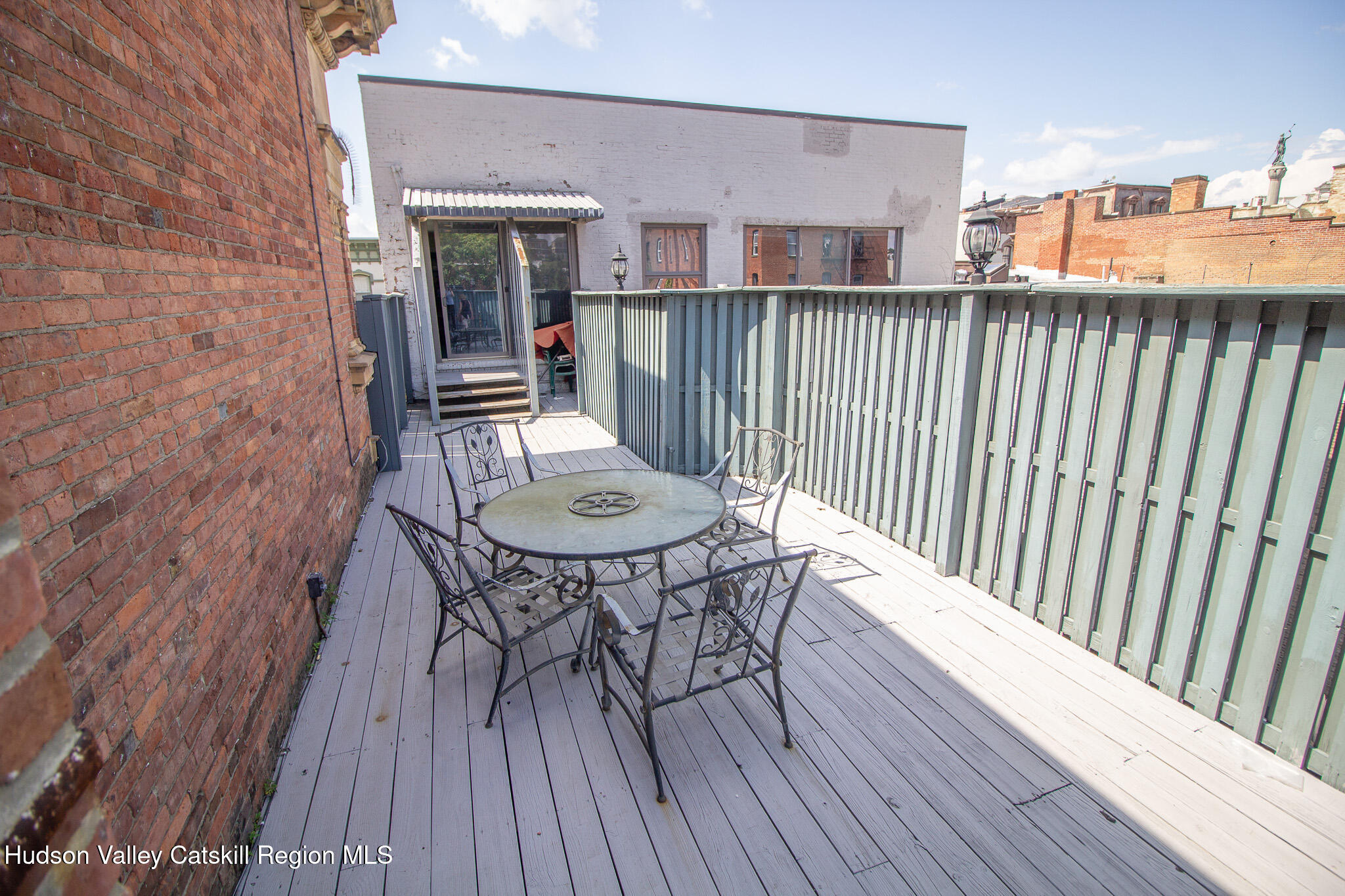 28 2nd Street Troy, NY 12180 - Photo 22 of 27 a view of a balcony with table and chairs