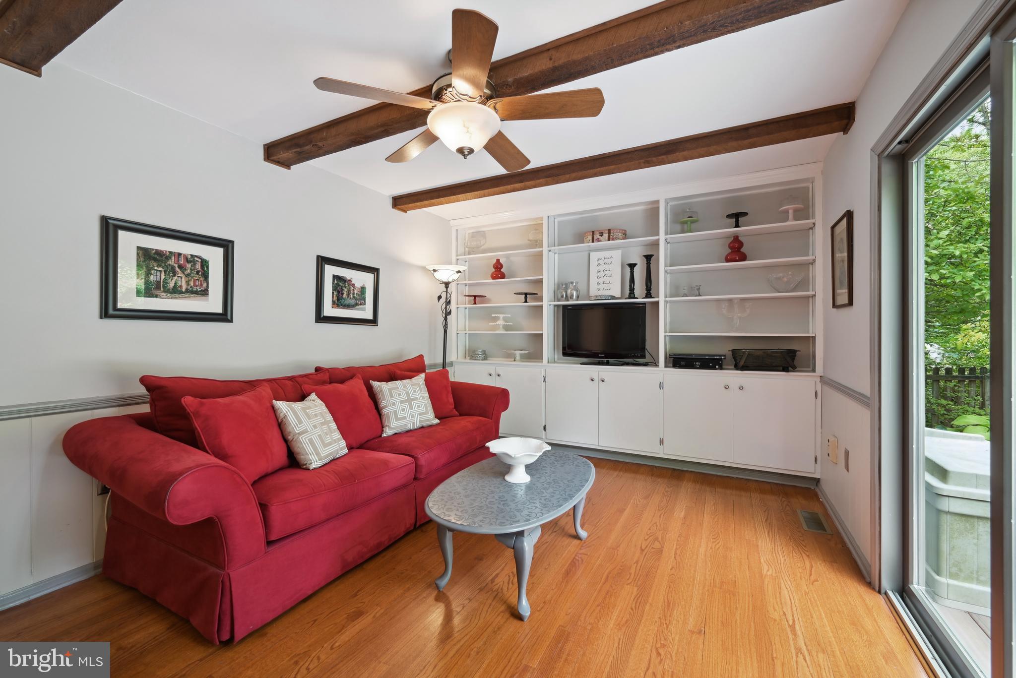 16 Fieldston Road West Windsor, NJ 08550 - Photo 17 of 34 a living room with furniture and a flat screen tv