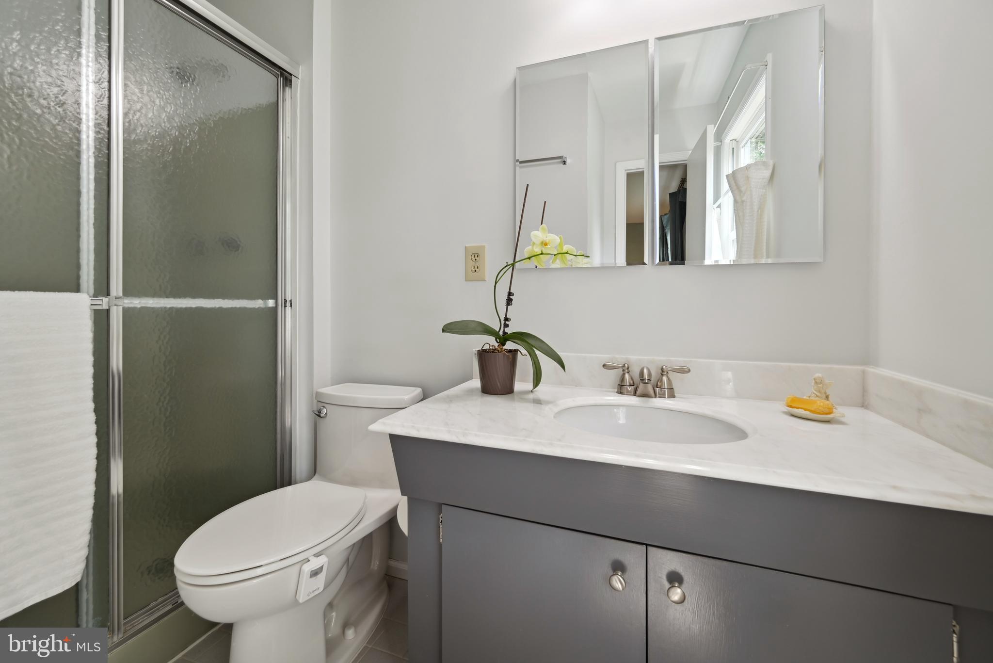 16 Fieldston Road West Windsor, NJ 08550 - Photo 22 of 34 a bathroom with a sink toilet and mirror