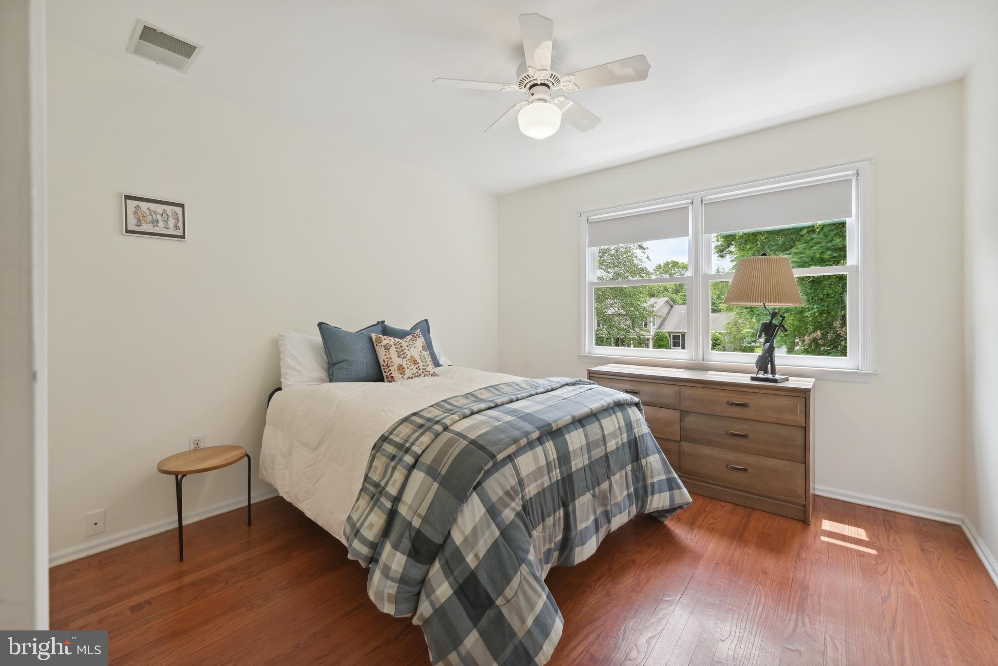 16 Fieldston Road West Windsor, NJ 08550 - Photo 25 of 34 a bed sitting in a bedroom next to a window