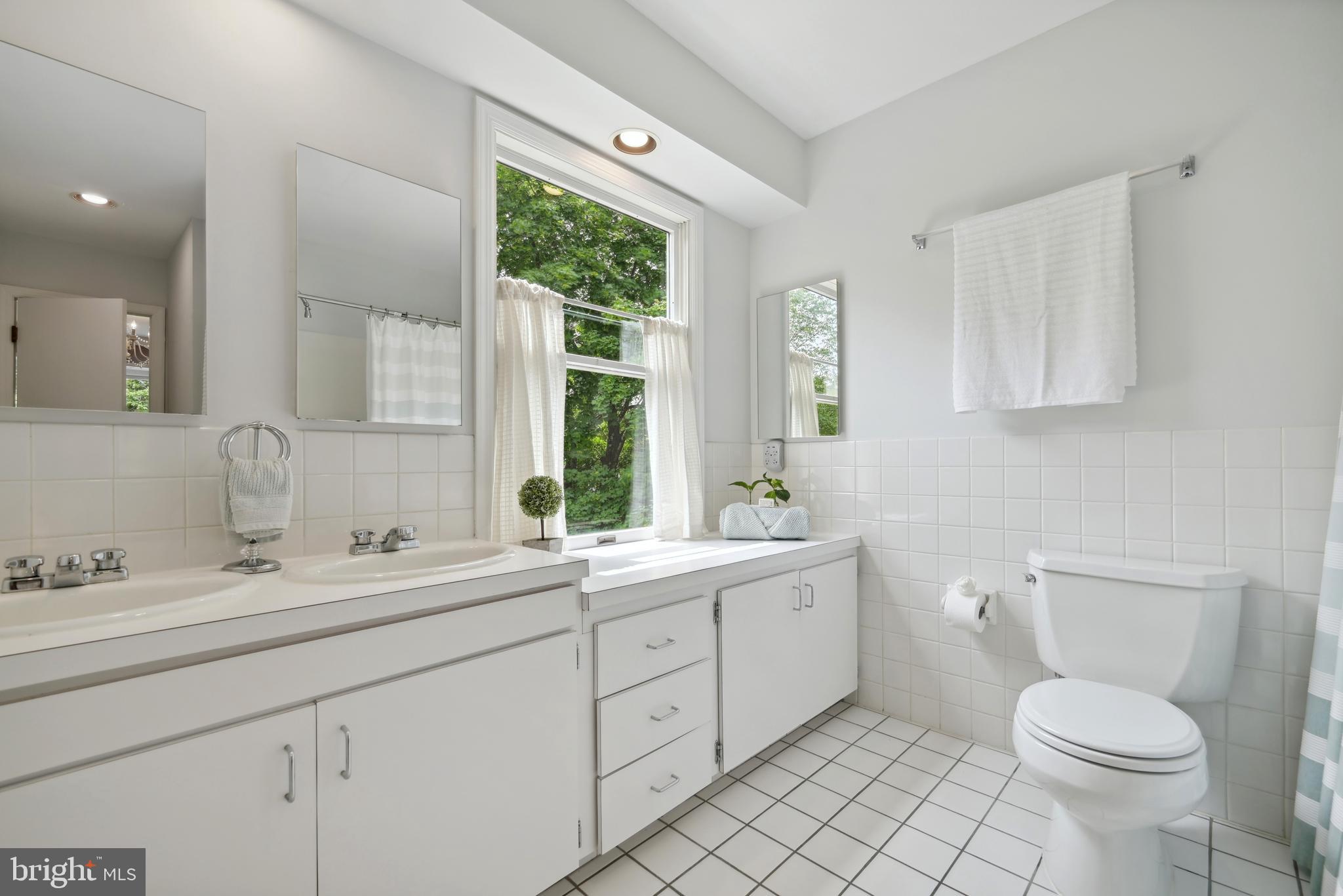 16 Fieldston Road West Windsor, NJ 08550 - Photo 30 of 34 a bathroom with a toilet sink and mirror